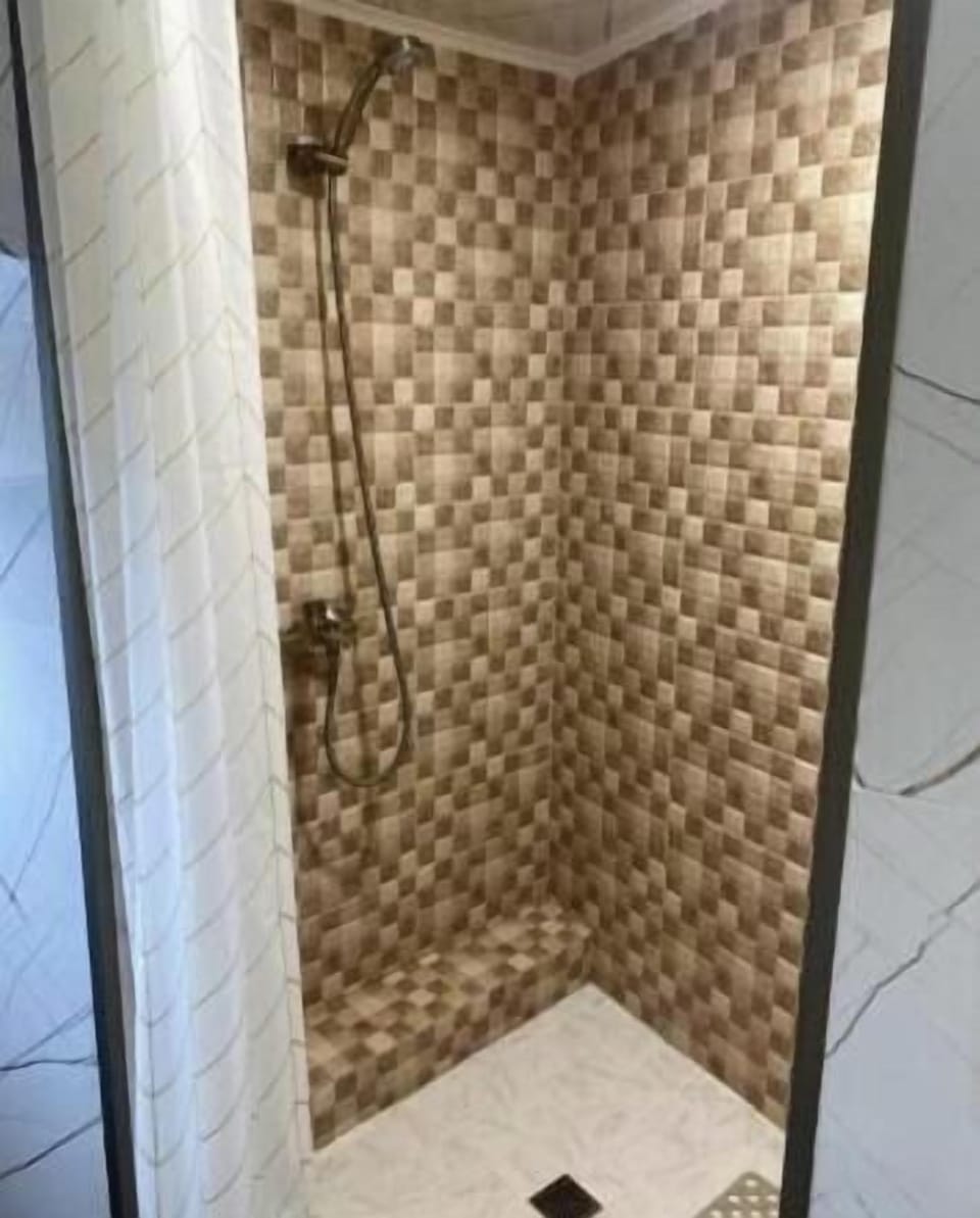 Shower, slippers, towels, soap
