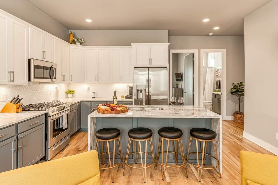 Cook at a marble-topped island with seating for four, and watch your guests pull up stools to chat and sip while you prep. Book your stay with Misfit Homes and make hosting from the kitchen feel effortless