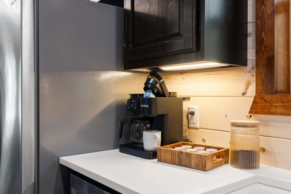 Coffee bar with drip machine, Keurig, and starter supplies so you can enjoy a fresh cup before exploring Broken Bow, plus plenty of counter space and thoughtfully labeled outlets for easy use