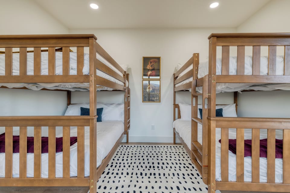 Bedroom 5 features 2 full-over-full bunk beds.