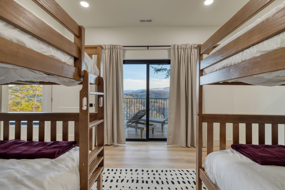 Bedroom 5 features 2 full-over-full bunk beds.