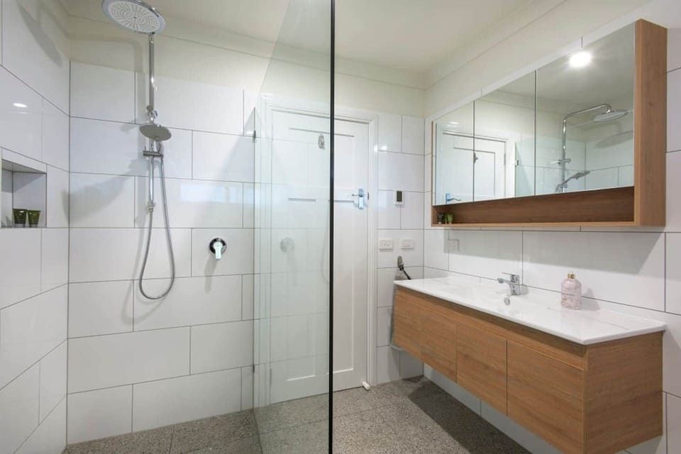 Towels, body wash, shampoo, hair fryer are all available in this modern bright clean bathroom. With heated floors for winter warmth.
