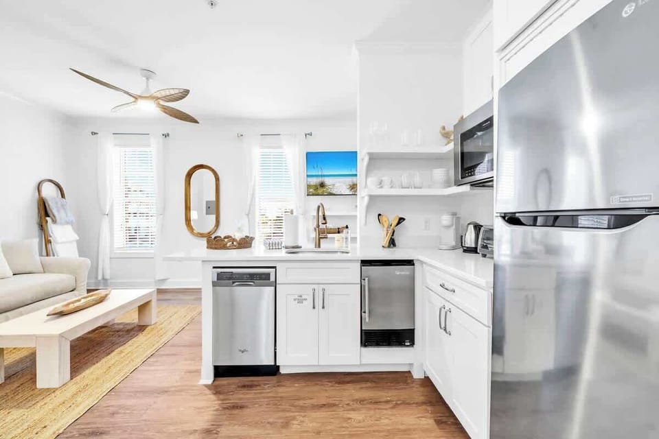 Kitchen in condo features a toaster over, microwave, dishwasher Keurig coffee maker, mini fridge/freezer, and dishes!