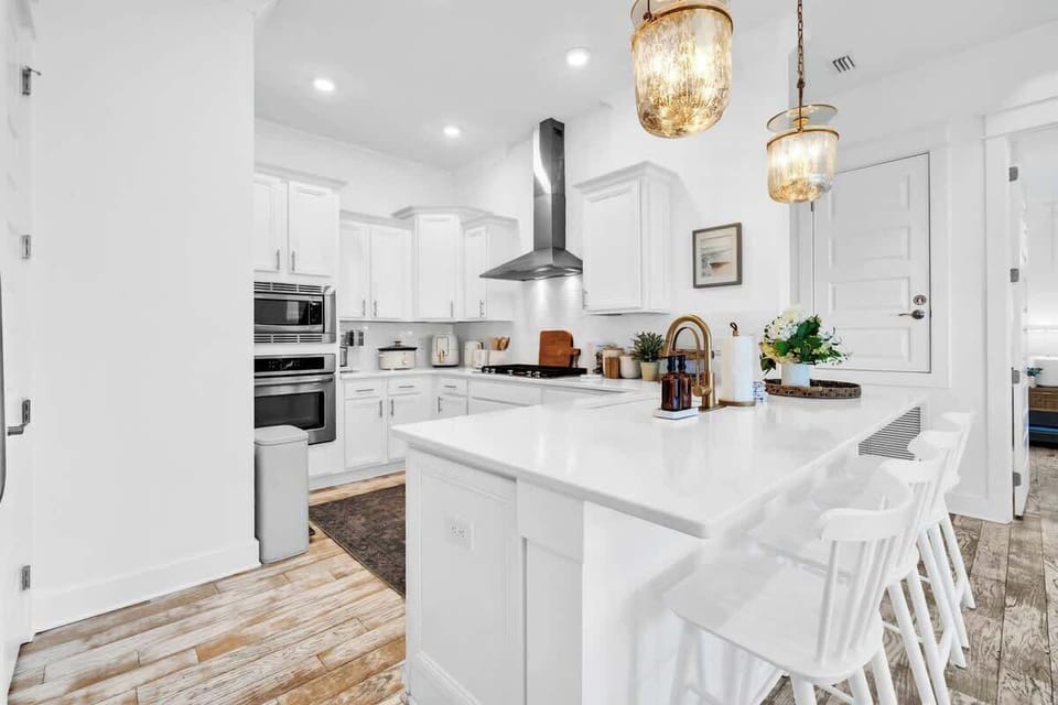 Kitchen island includes seating for three.
