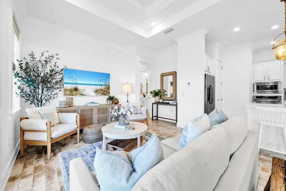 Living room features plenty of seating and a smart tv.