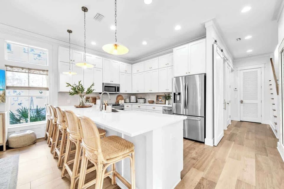 The fully equipped kitchen features island seating for four.