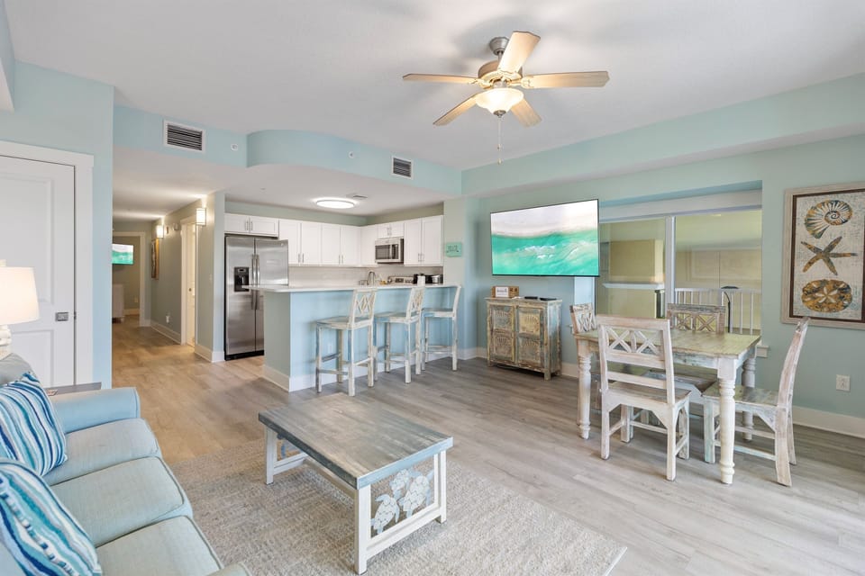 Relax in your coastal-inspired open-plan space where sea foam walls and beach décor create instant vacation vibes.