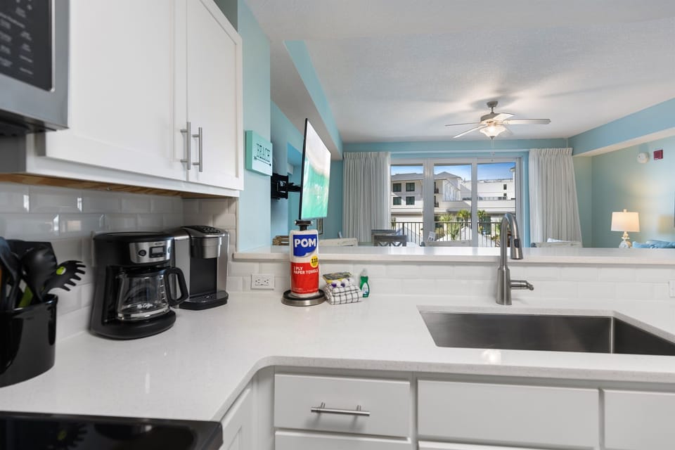 Your fully equipped kitchen features modern appliances and opens to the living area, perfect for preparing meals while staying connected with family.