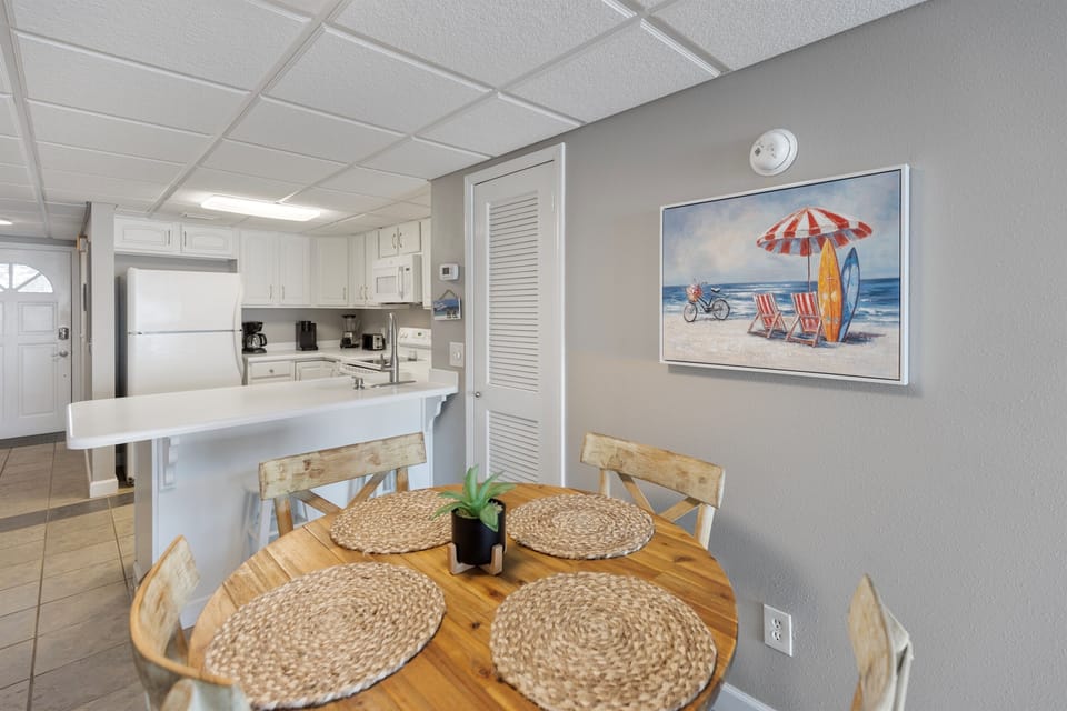 Gather around your cozy dining table for meals while enjoying the open-concept flow to your fully equipped kitchen.