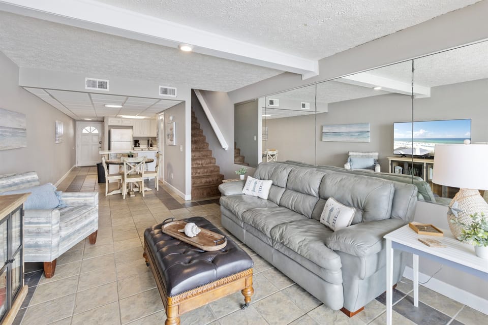 Sink into plush leather seating while ocean views fill your windows in this bright, open living space.