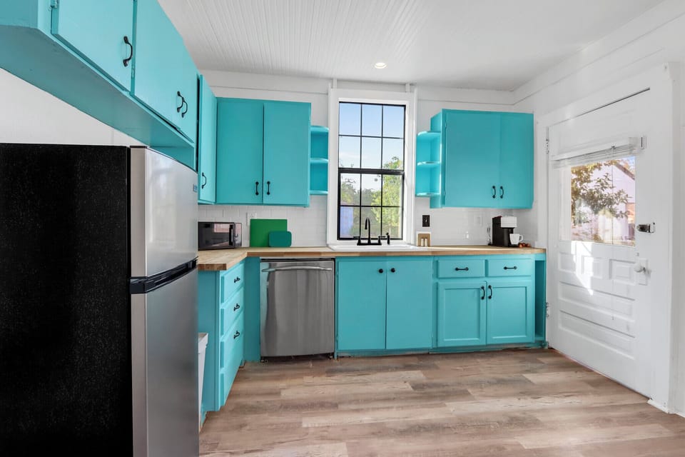 The kitchen is conveniently adjacent to the dining