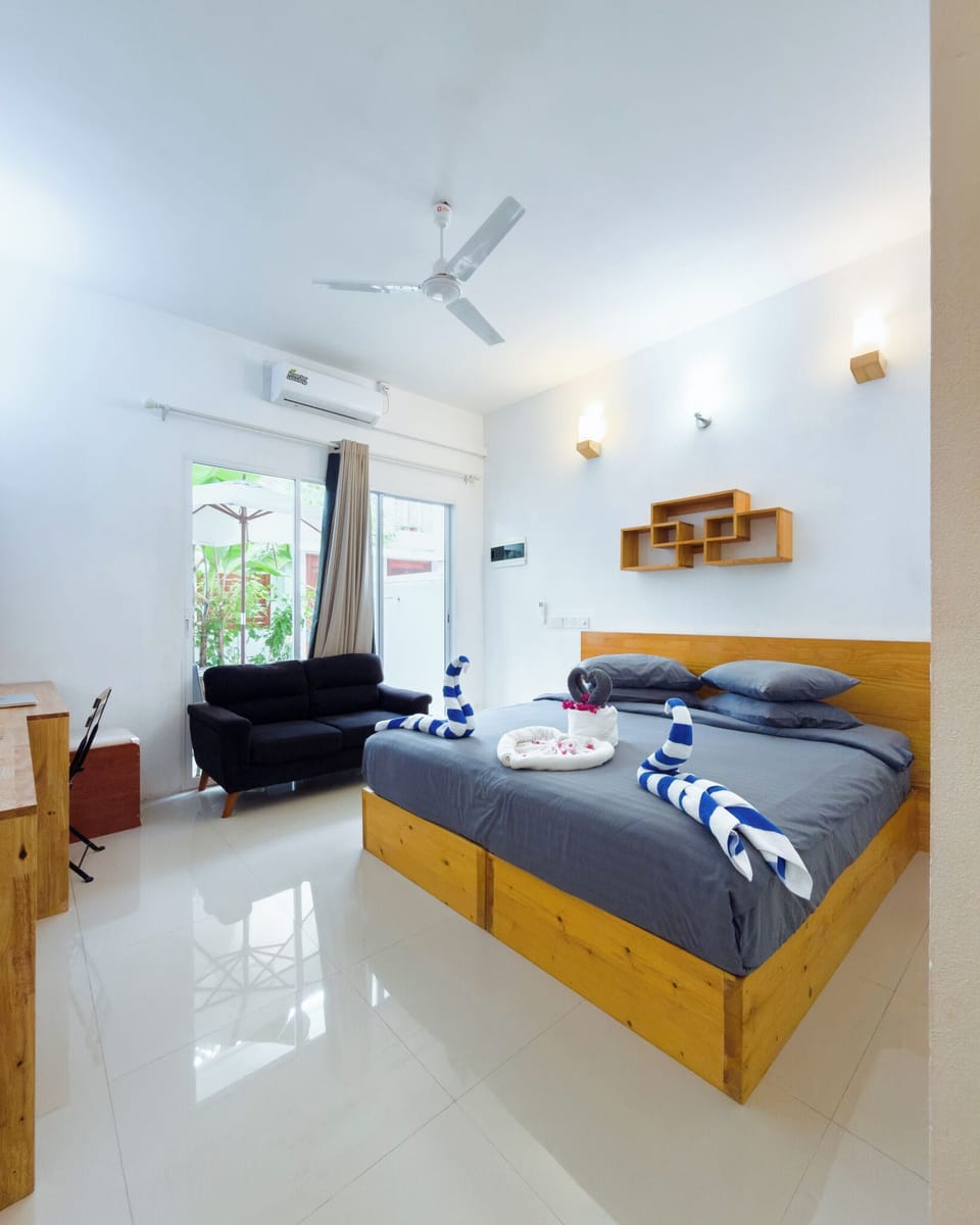 Deluxe Double Room, Patio, Garden View | In-room safe, blackout drapes, iron/ironing board, free WiFi