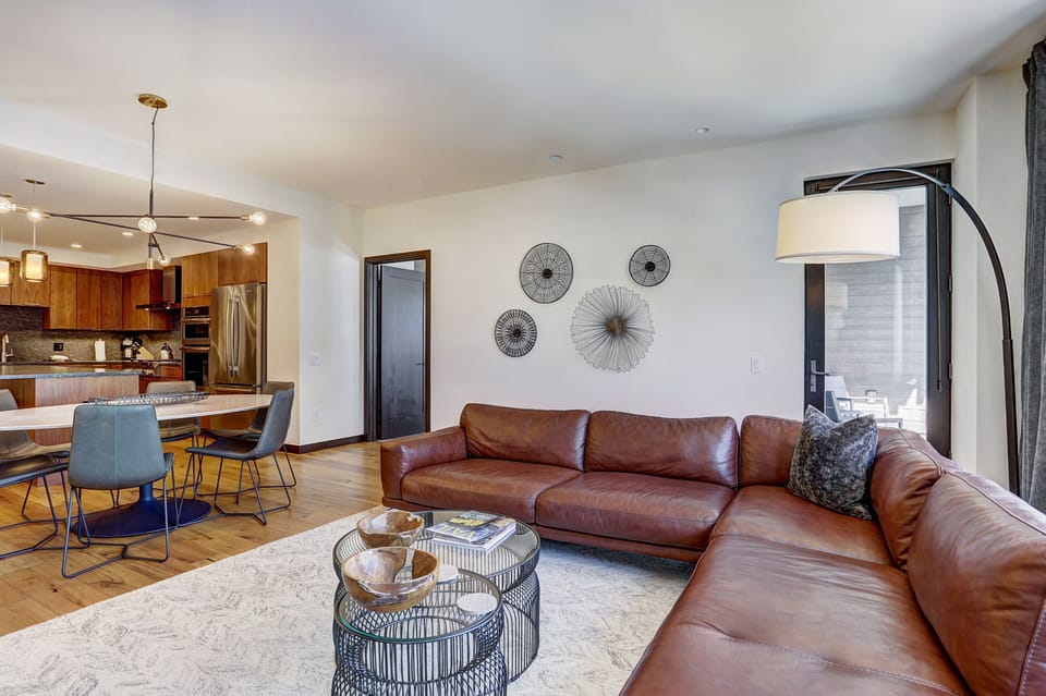 Spacious great room layout connecting the seating area to the gourmet kitchen and dining space.