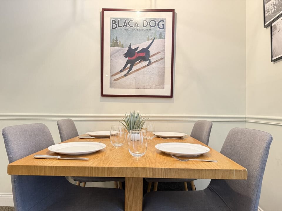 Gather around a dining table for four guests.