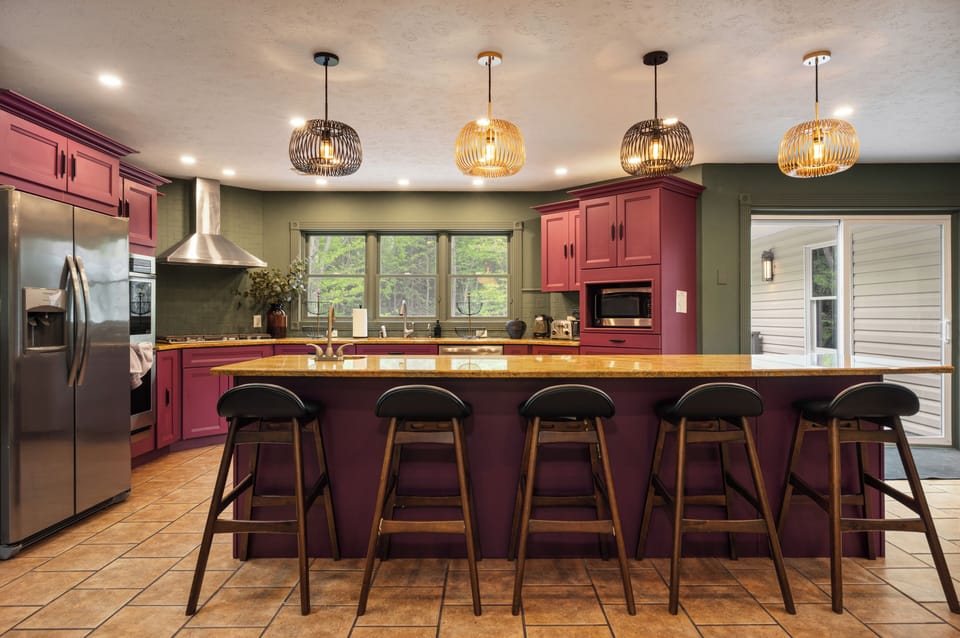 Spacious designer kitchen with large island seating for 5