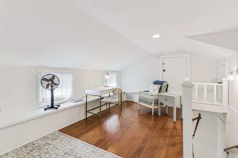 Your upstairs retreat features beautiful hardwood floors, a cozy reading nook, and workspace where you can unwind in comfort.