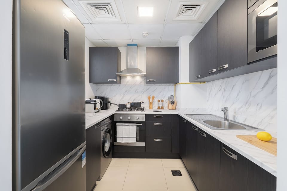 Luxury Apartment, Balcony, City View | Private kitchen | Full-size fridge, microwave, oven, stovetop