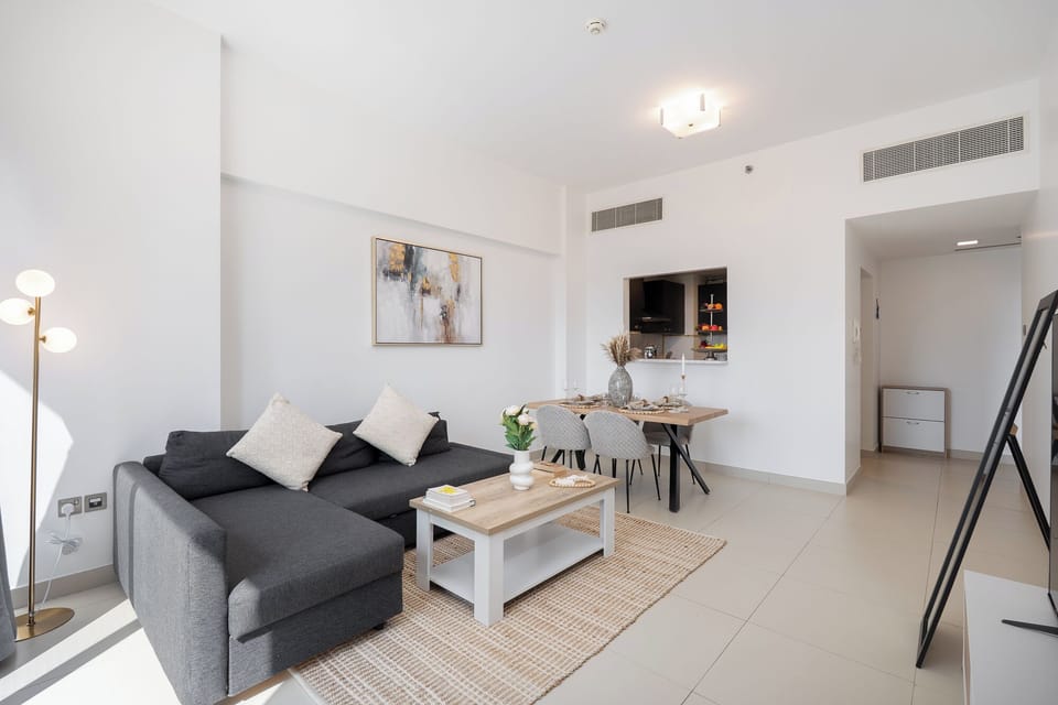 Luxury Apartment, Balcony, City View | Living area | 65-inch Smart TV with cable channels