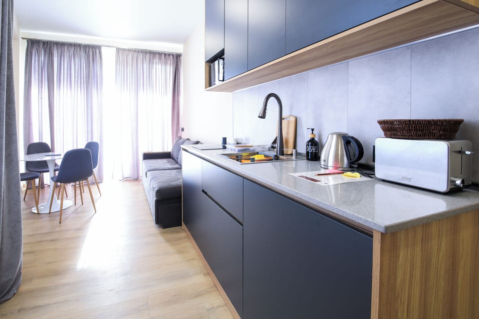Comfort Apartment, Balcony, Mountain View | Private kitchen | Mini-fridge, microwave, highchair, cookware/dishes/utensils