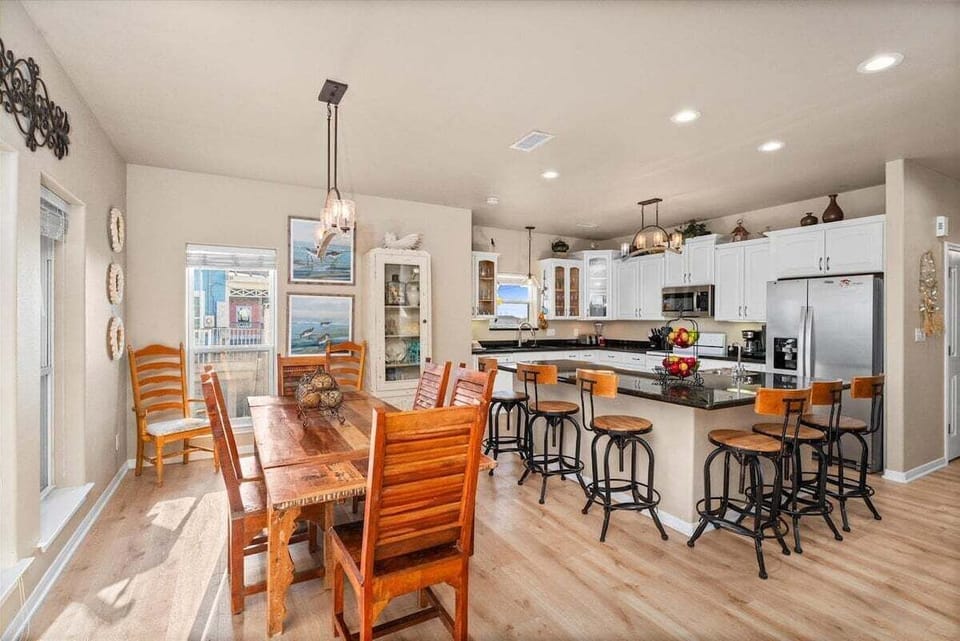 Modern kitchen and dining space with open layout and beach house style