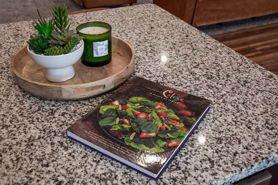 Kitchen w/ modern appliances, generous counters, & easy flow to living areas.