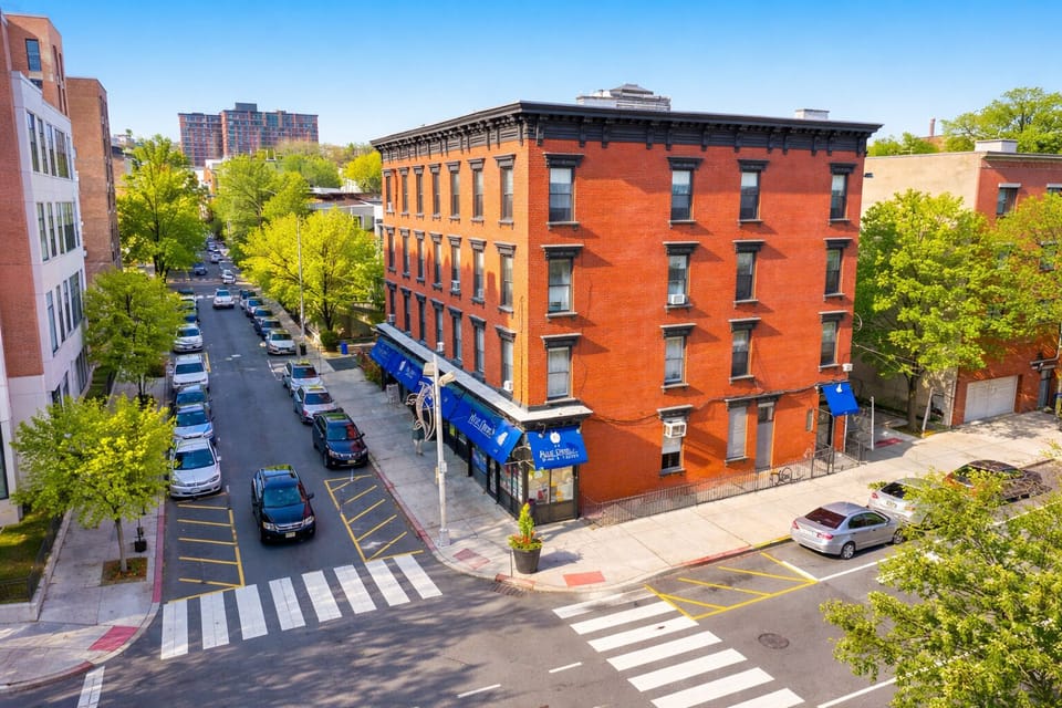Charming corner brick building in a walkable, tree-lined neighborhood
