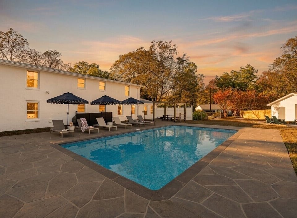 Lounge by the sparkling pool and soak in the peaceful surroundings, where shaded seating and open skies invite you to slow down, unwind, and enjoy every moment outdoors.
