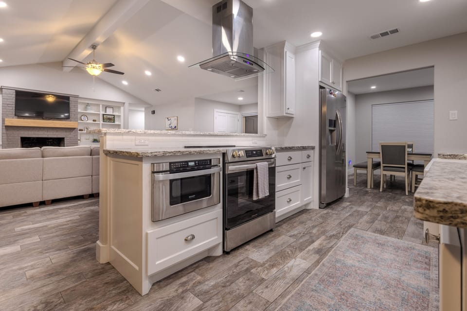 Open, modern, and fully stocked kitchen with gorgeous lake views