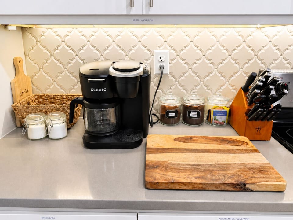 Coffee station is stocked with regular, decaf, and several tea flavors. 