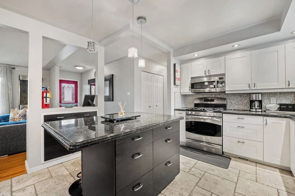 Full kitchen with a drip coffee maker, blender and an air fryer.