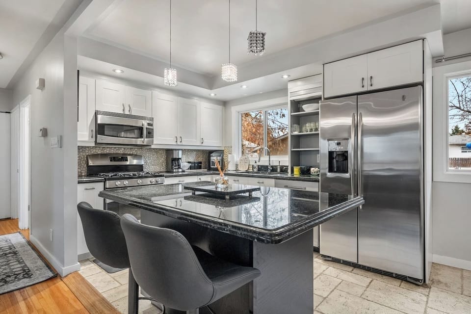 Full kitchen with a drip coffee maker, blender and an air fryer.
