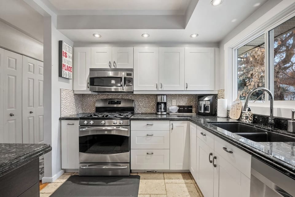 Full kitchen with a drip coffee maker, blender and an air fryer.