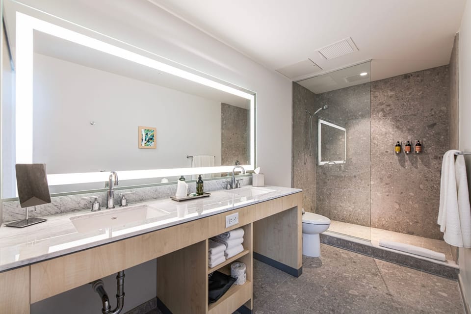 Step into a thoughtfully designed bathroom where luxury meets functionality in every detail.