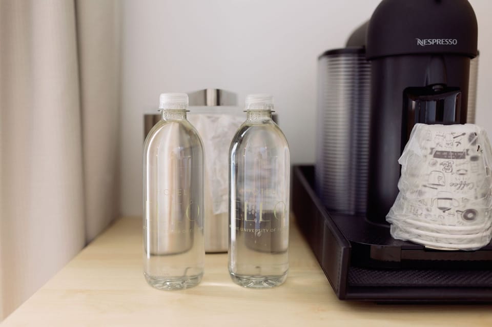 Bottled water and thoughtful touches reflect the attentive design of this modern hotel haven.