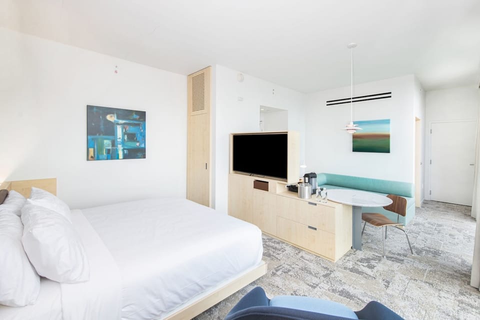 Experience the perfect blend of modern elegance and urban comfort in this luxurious king-bedded guestroom at Hotel Eleo, ideally situated near the vibrant University of Florida campus.