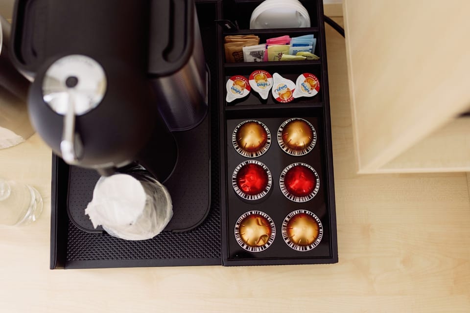 A state-of-the-art Nespresso coffee maker awaits, making mornings by the lake blissfully indulgent.