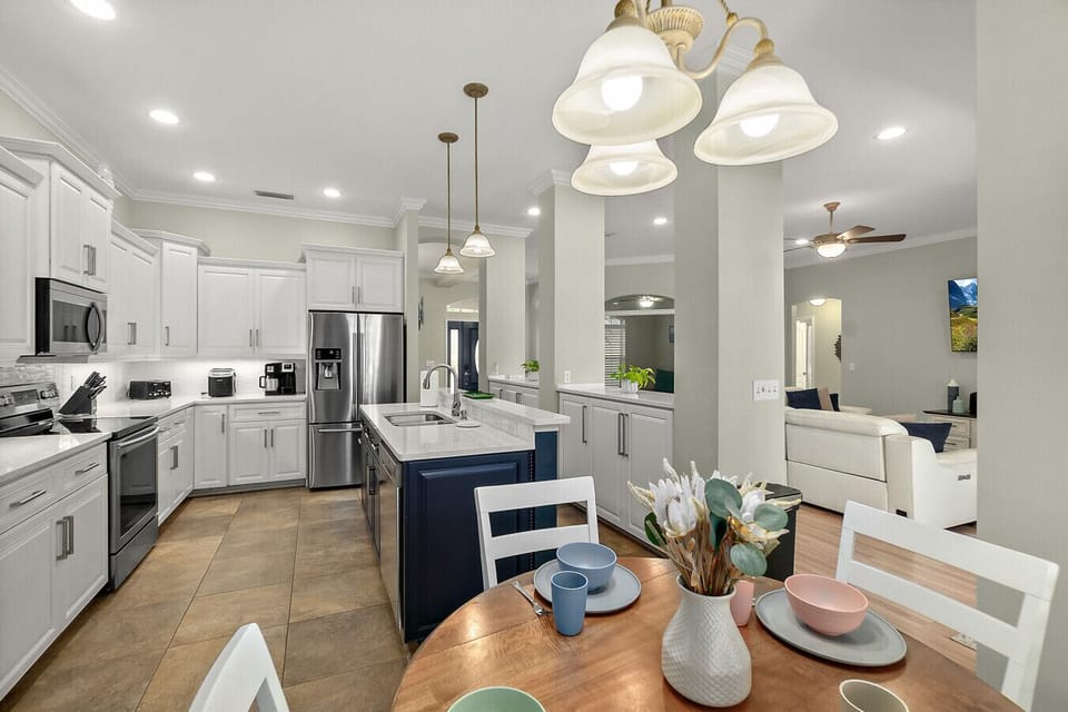 Updated kitchen with quartz counters, breakfast nook, and stainless appliances