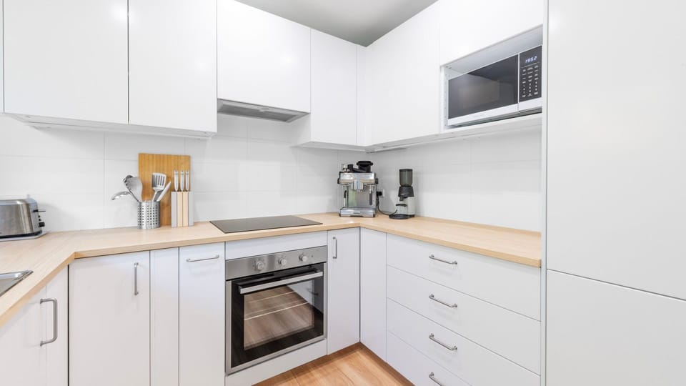 Sleek, fully equipped kitchen ready for home-cooked meals
