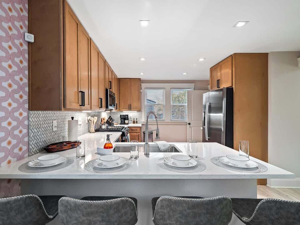 - Breakfast bar with modern seating for four   - Fully equipped Airbnb kitchen for easy cooking   - Stylish bright space designed for convenience  
