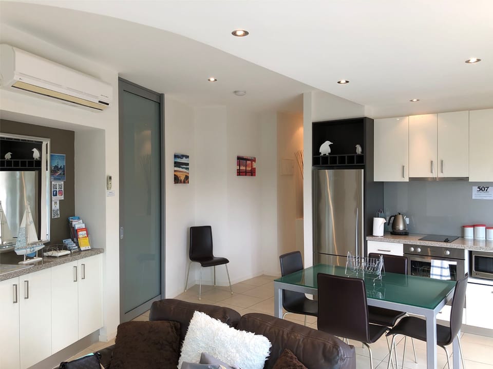 Executive Apartment, 2 Bedrooms, Balcony, Partial Ocean View | Private kitchen | Full-size fridge, microwave, stovetop, dishwasher