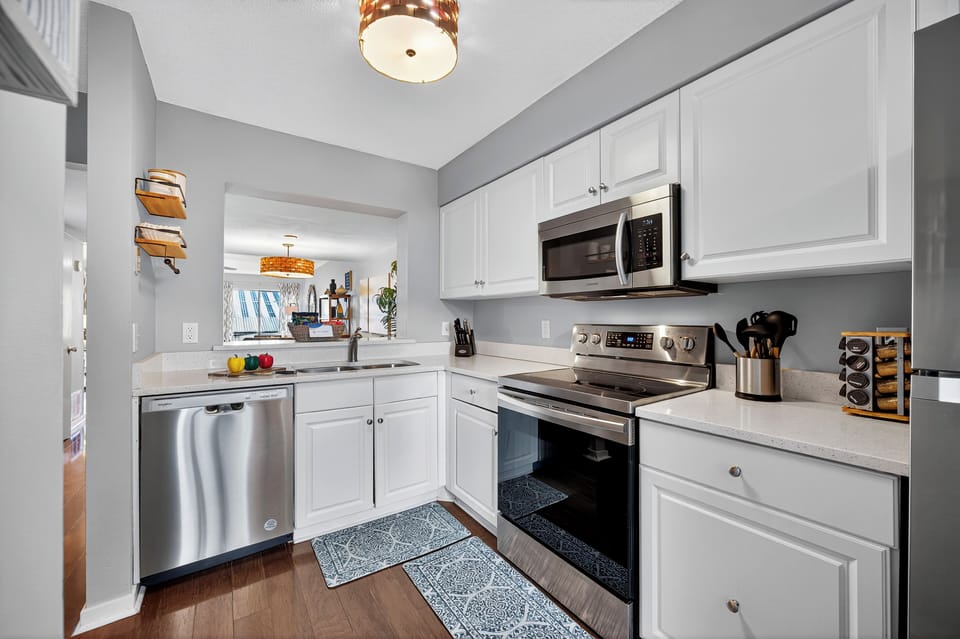 Prepare meals with ease in the fully equipped kitchen featuring ample cooking space, modern appliances, and everything you need for a home-cooked meal.