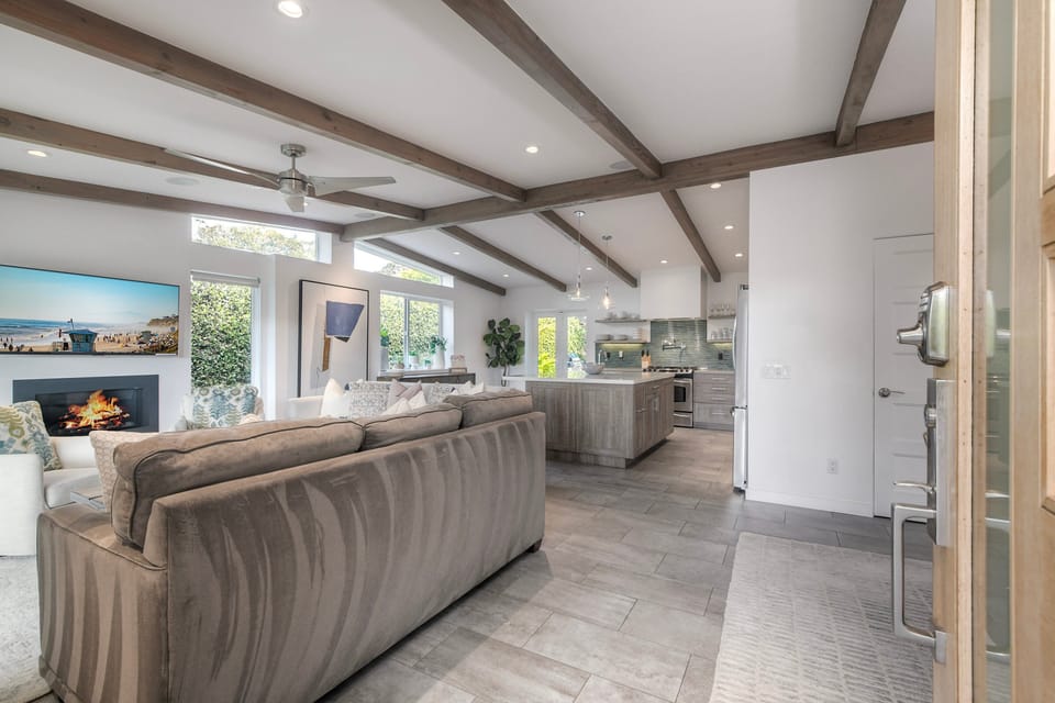 You enter the front door into a bright open living area