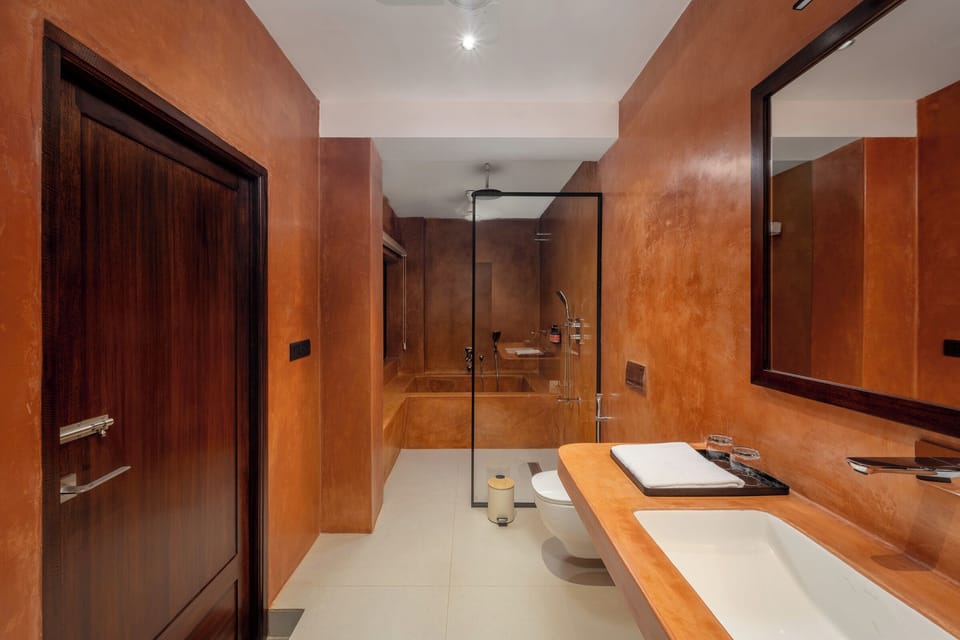 Deluxe Suite, Balcony, City View | Bathroom | Free toiletries, hair dryer, slippers, towels