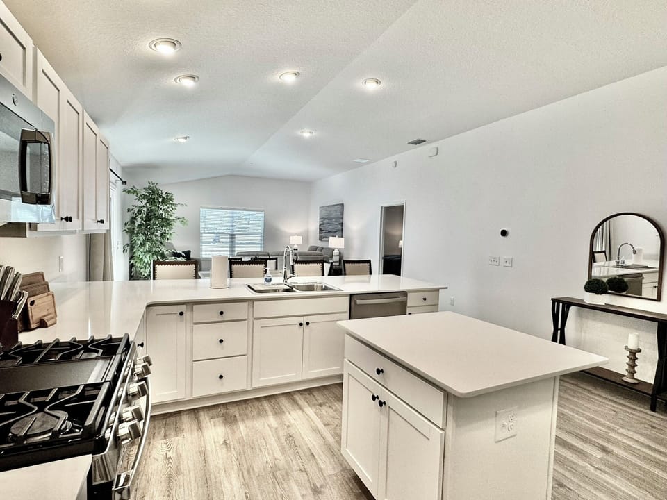 Open and Airy Kitchen with Ample Counter Space; Breakfast Bar and Island