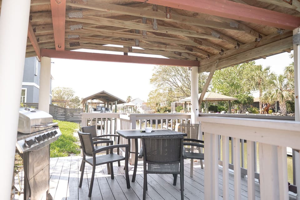Dockside patio with grill and seating for a meal on the canal watching the sunset!