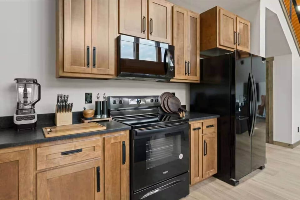 Cook with ease in a gourmet kitchen with high-end appliances and space.