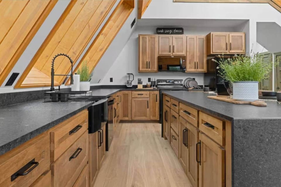 Cook with ease in a gourmet kitchen with high-end appliances and space.