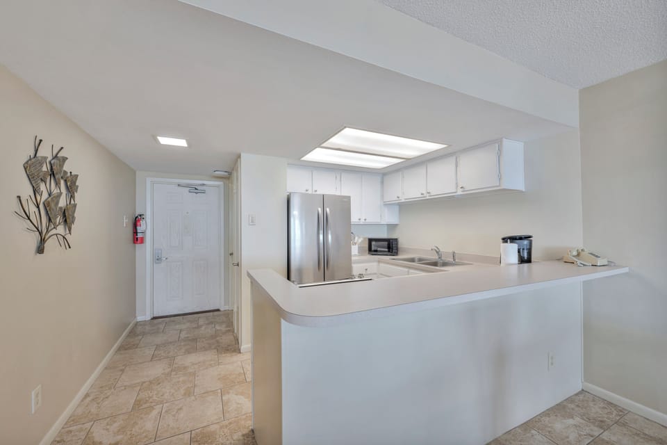 Your fully equipped kitchen features stainless steel appliances and ample counter space for preparing memorable vacation meals together.