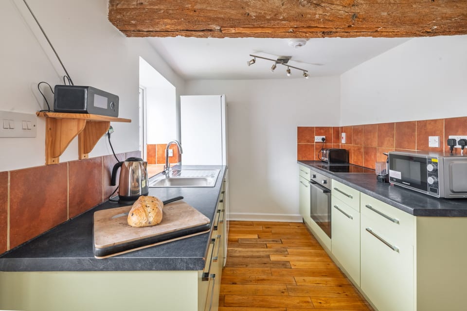 Ground floor: Kitchen leading to the enclosed garden