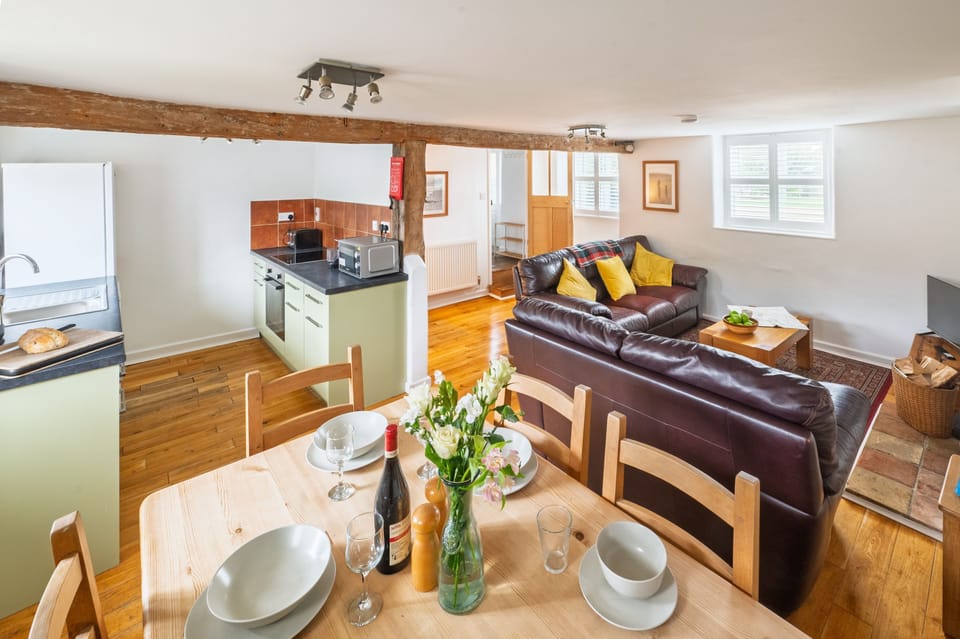 1 Ruscon Cottage, Brancaster Staithe: Open plan dining area with kitchen and sitting room